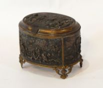 A French bronze and gilt metal oval jewellery casket decorated panels with dancing figures,