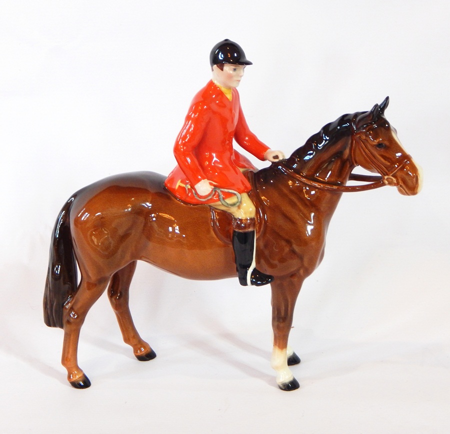 A Beswick huntsman on a bay horse