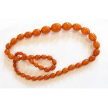 String of orange amber-type graduated beads