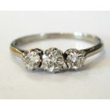 Platinum and 18ct gold three-stone diamond ring, the three stones approx. total 0.