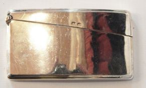 A George V silver card case of plain curved form, with hinged cover,