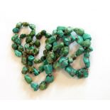 A string of graduated turquoise tumble beads