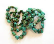 A string of graduated turquoise tumble beads