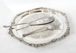 A silver-plate circular tray with shell and bead borders,