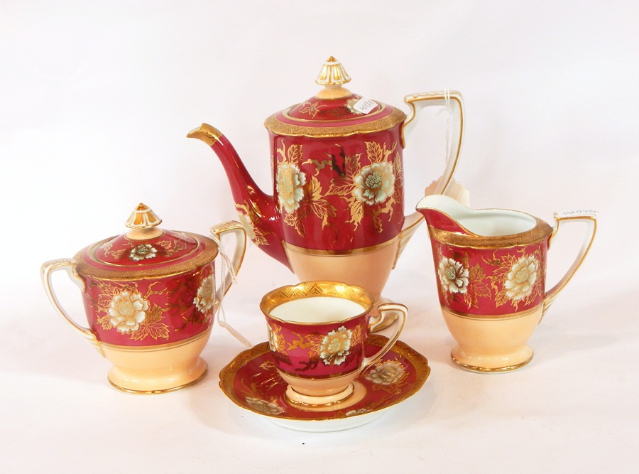 A Noritake porcelain coffee service for six persons decorated with peonies in gilt,
