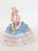 A Royal Doulton porcelain figure 'Chloe', a lady in blue and pink formal dress and bonnet,