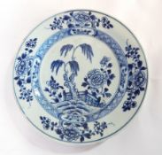 Chinese blue and white bowl with prunus blossom above frieze of reserves interspersed with weave