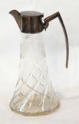 An Edwardian silver-mounted claret jug with cut glass collar to spreading spiral base,