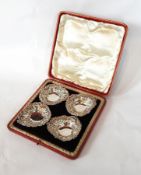 A set of four Victorian silver heart-shaped bonbon dishes with C-scroll floral borders and open