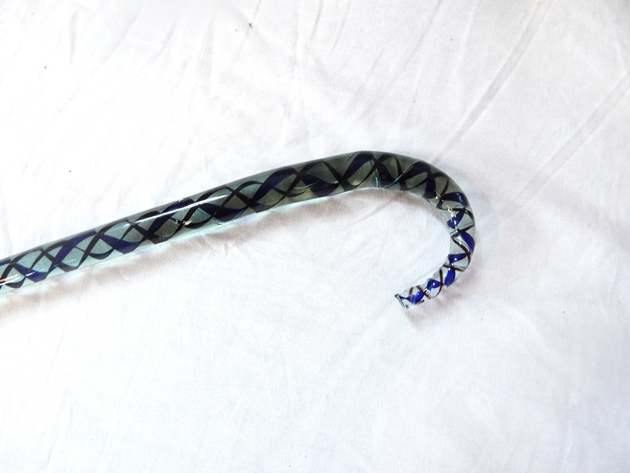 A glass walking cane, with barleytwist coloured inclusions blue and brown,