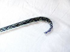 A glass walking cane, with barleytwist coloured inclusions blue and brown,