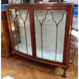 A Chippendale style mahogany bow front display cabinet,