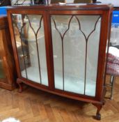 A Chippendale style mahogany bow front display cabinet,