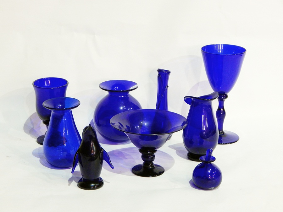 A Bristol type blue glass model penguin and a quantity similar glass vases (1 box)