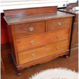 A chest of two short and two long drawers, with stringing border, brass circular handles,