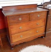 A chest of two short and two long drawers, with stringing border, brass circular handles,