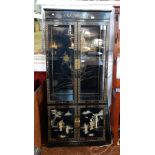 A black lacquered chinoiserie style display cabinet,