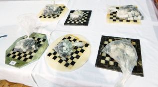 A quantity of Moroccan polished stone chess boards and pieces