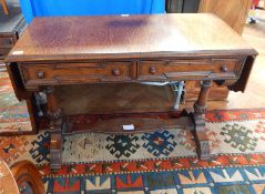 An oak drop flap sofa table, with moulded edge top,