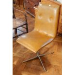 A pair of 20th century button leather swivel chairs, on chromed steel pedestal splayed legs,