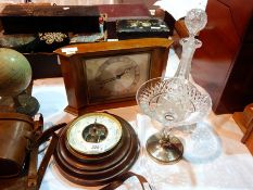 A pair of binoculars in a leather case, an aneroid barometer, an oak cased wall clock by Elliott,