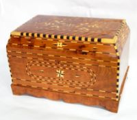 A large inlaid Moroccan thuya wood casket with floral and chequerwork inlays and fitted interior,