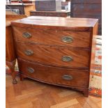 19th century mahogany bow front chest of three long drawers with ogee plate handles on bracket feet,