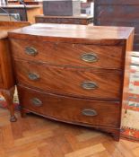 19th century mahogany bow front chest of three long drawers with ogee plate handles on bracket feet,