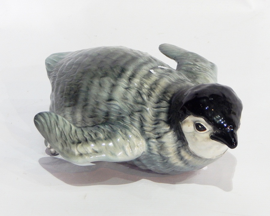 Beswick model of a penguin chick sliding, model no.2434, 22cm long approx.