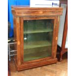 A Victorian walnut display cabinet with satinwood shell and fan inlay ormolu mounts,