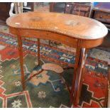 An Edwardian Kingwood kidney shaped side table, the top painted with figures of cavaliers,