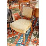 A pair of late Victorian walnut dining chairs with upholstered panelled backs, stuffover seats,