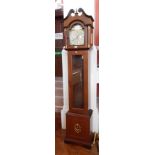 An reproduction longcase clock with swan neck pediment, silver dial, three day striking movement,