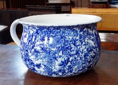 A blue and white chamber pot with floral decoration,