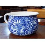 A blue and white chamber pot with floral decoration,