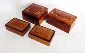 Two Moroccan thuya wood boxes with fitted interiors and a pair of rectangular boxes with ebony