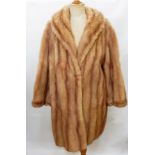 A vintage mink coat with bell sleeves,