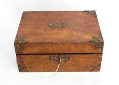 A burr walnut sewing box with brass decorative mounts, fitted interior with contents,