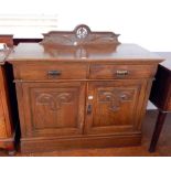 An early Victorian oak sideboard with art nouveau style carving,