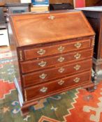 A George III mahogany bureau, with cheviot wood crossbanding,