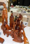 A collection of carved wooden figures by Thomas Ralph to include animals,