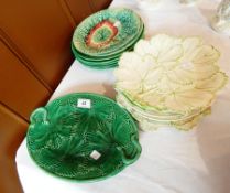 A quantity of Victorian and later leaf moulded pottery plates in varying colours