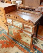 A Victorian oak washstand with one short frieze drawer, on bobbin and tapering supports,