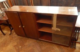 A modern side cupboard with bookcase and glass sliding doors,