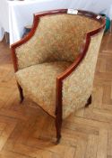 A tub chair with floral uphoolstered,