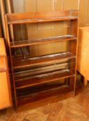 A mahogany bookcase of five open shelves on a plinth base,
