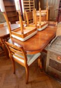 A modern 20th century pedestal table with four chairs