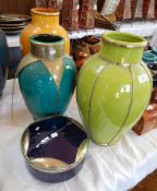 Three Moroccan brightly coloured glazed and silver-coloured metal mounted pottery vases and a