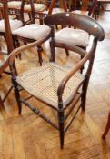 An oak chair on tapering supports and bun feet,