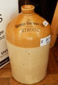 A large stoneware flaggon, marked The Stroud Brewery Company Limited and another smaller, baskets,